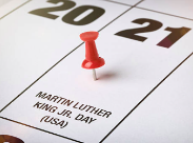 A red pin on a calendar date for February 21st, Martin Luther King Jr. Day